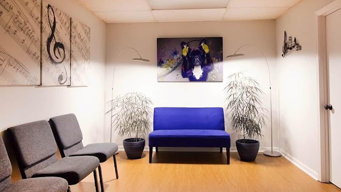 Bright lounge with chairs and abstract artwork