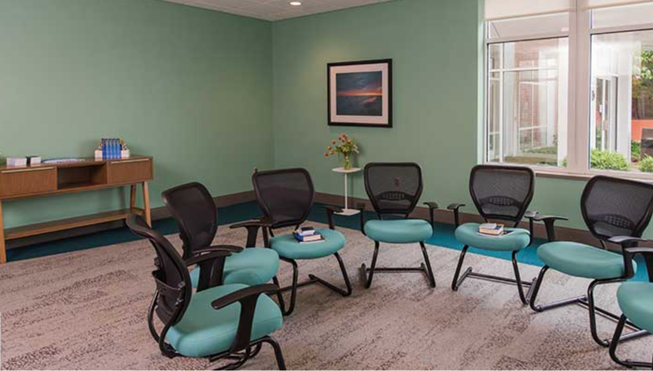 Therapy room with chairs in a circle near window