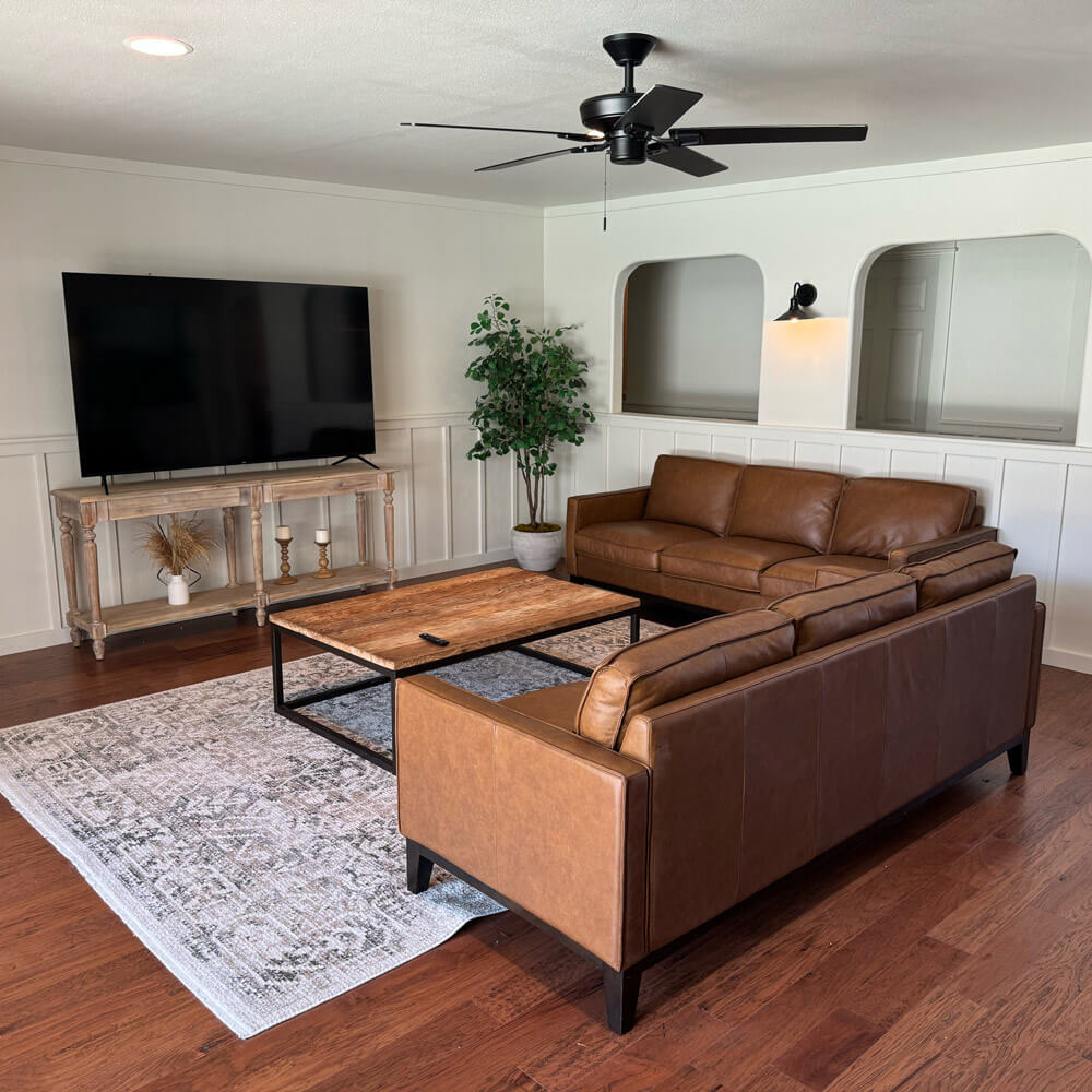 Cozy lounge with leather sofas and a large flat-screen TV