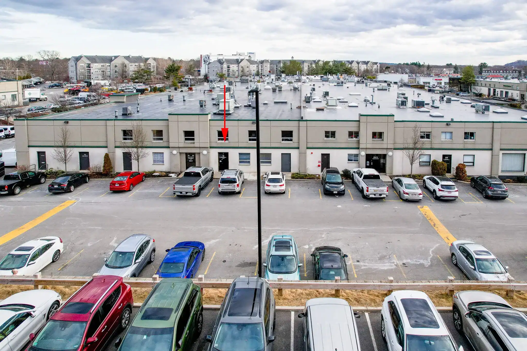Exterior view of Woburn Wellness building and parking