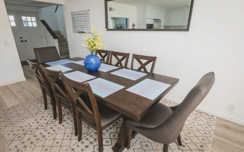 Dining table with eight chairs and placemats