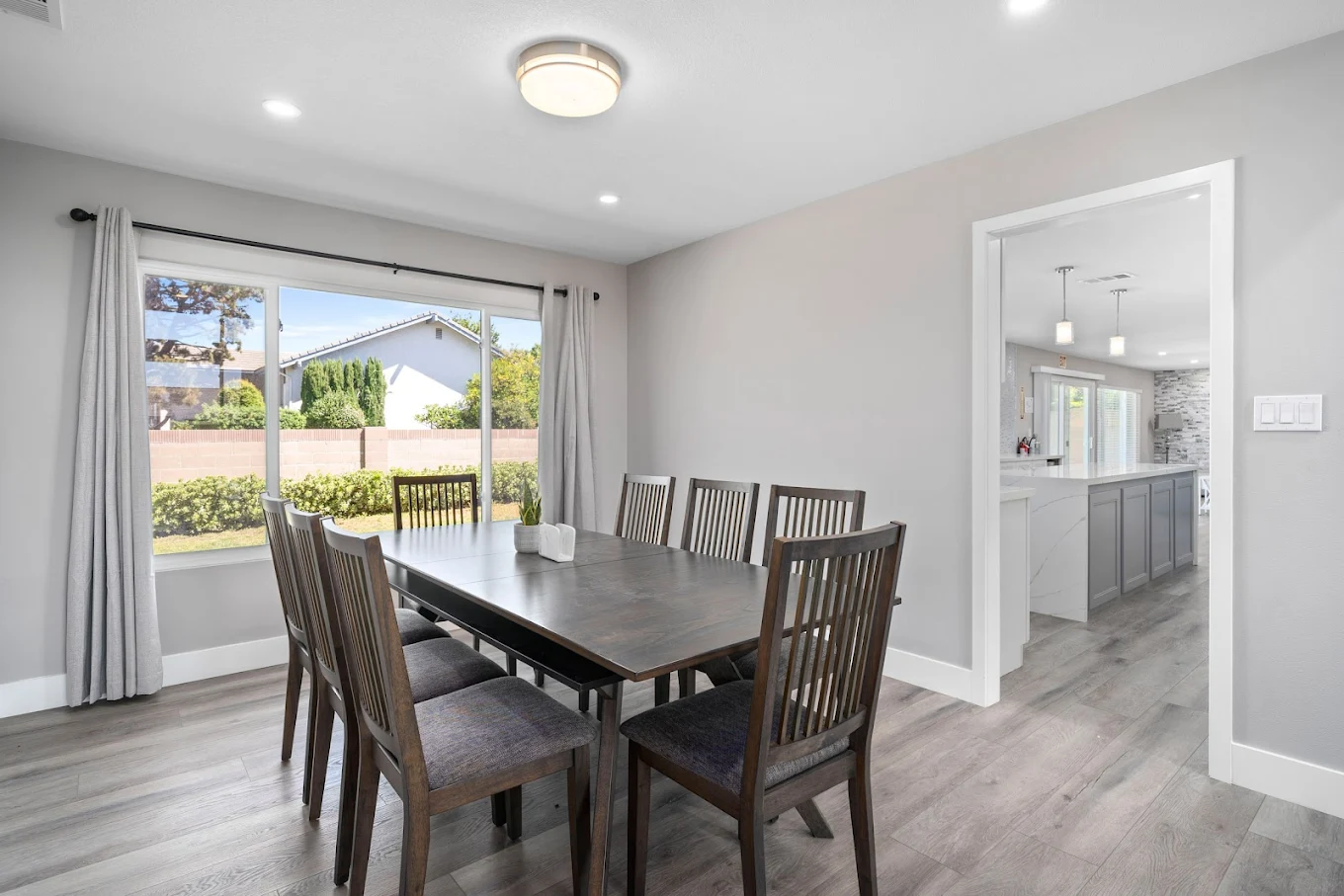 Dining room with long table and large window view
