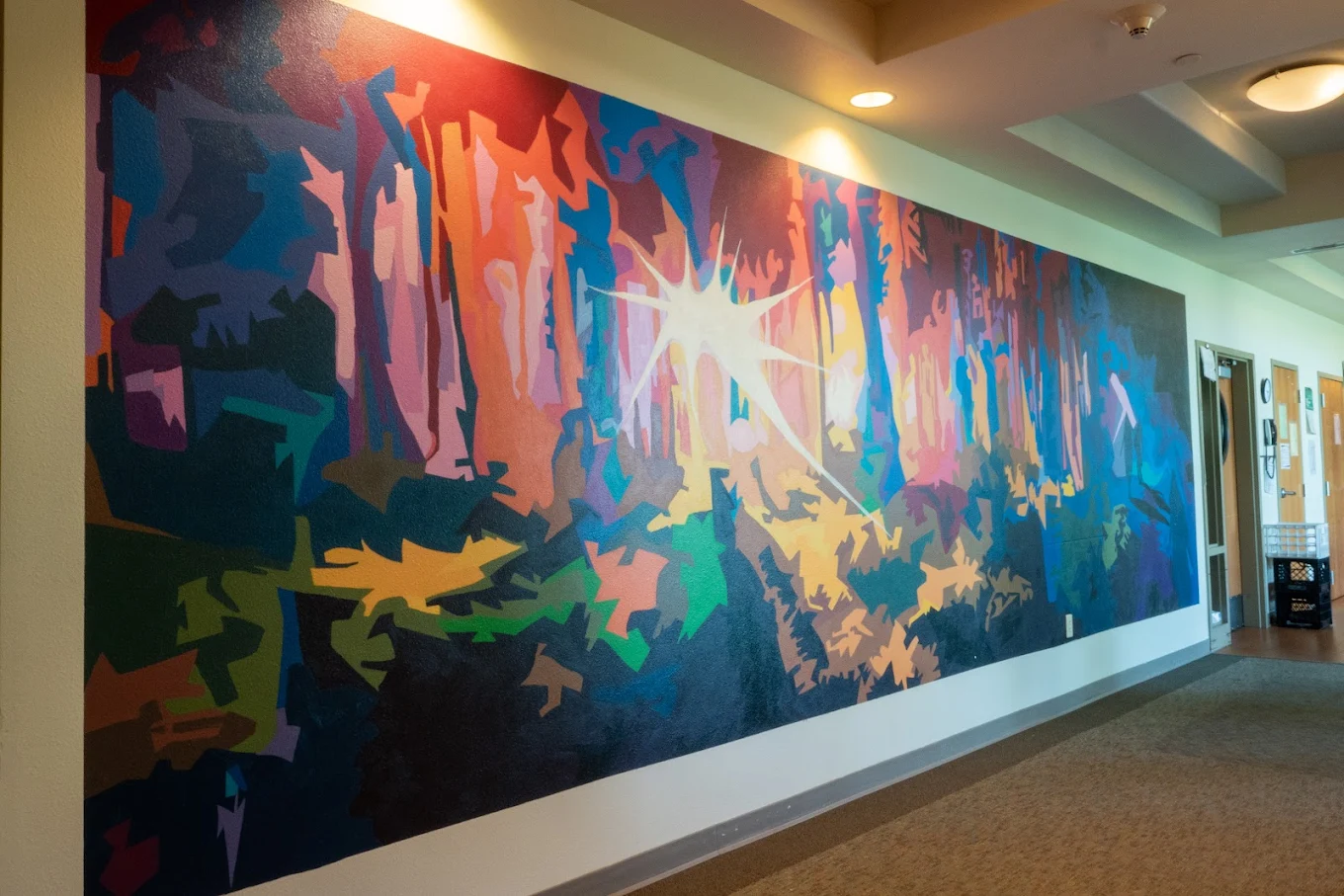 Colorful drawings and motivational art displayed on a wall