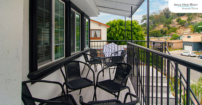 Balcony with seating overlooking the neighborhood