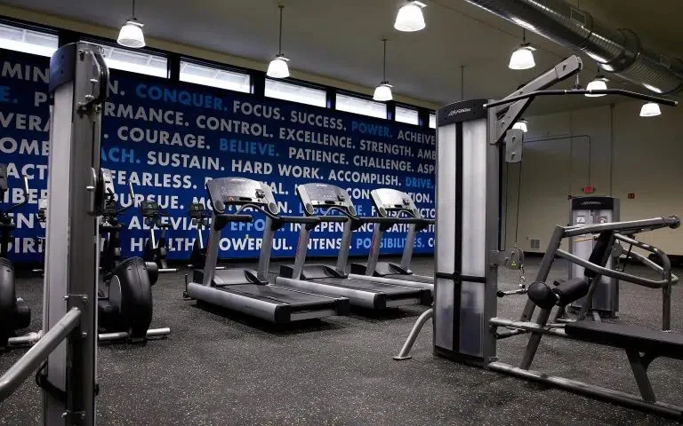 Fitness center with treadmills and strength training equipment