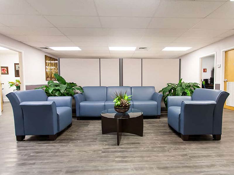 Lounge with blue sofas and coffee table