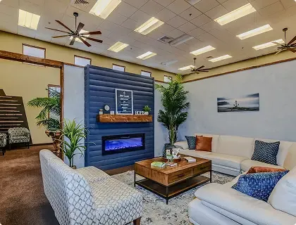 Resident lounge with fireplace and comfortable seating