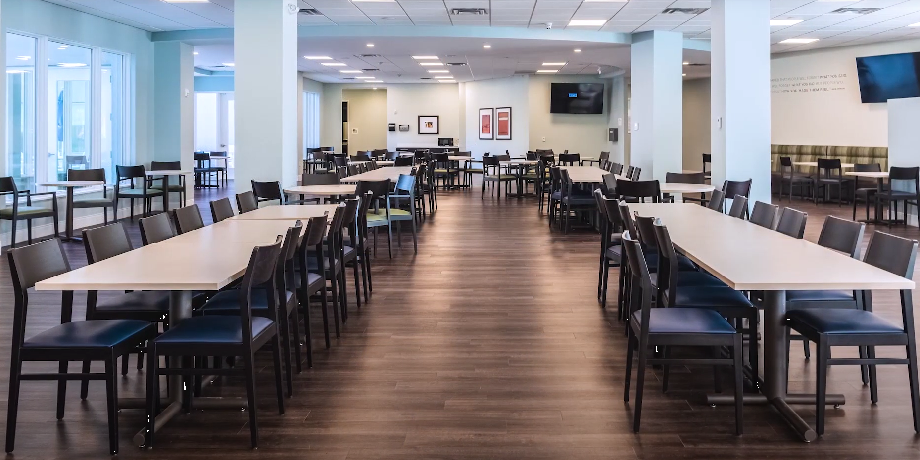 Large dining room with tables and chairs for residents
