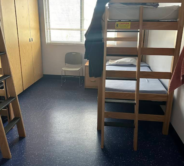 Simple shared bedroom with wooden bunk beds