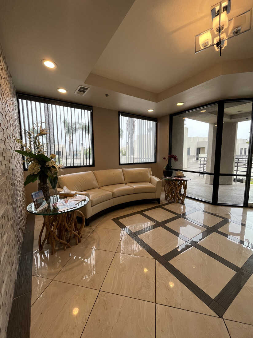 Modern lobby with cream sofa and large windows