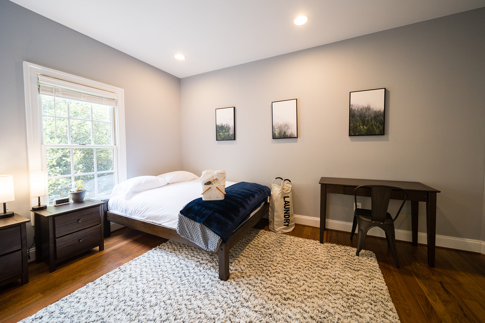 Modern bedroom with desk and decorative art