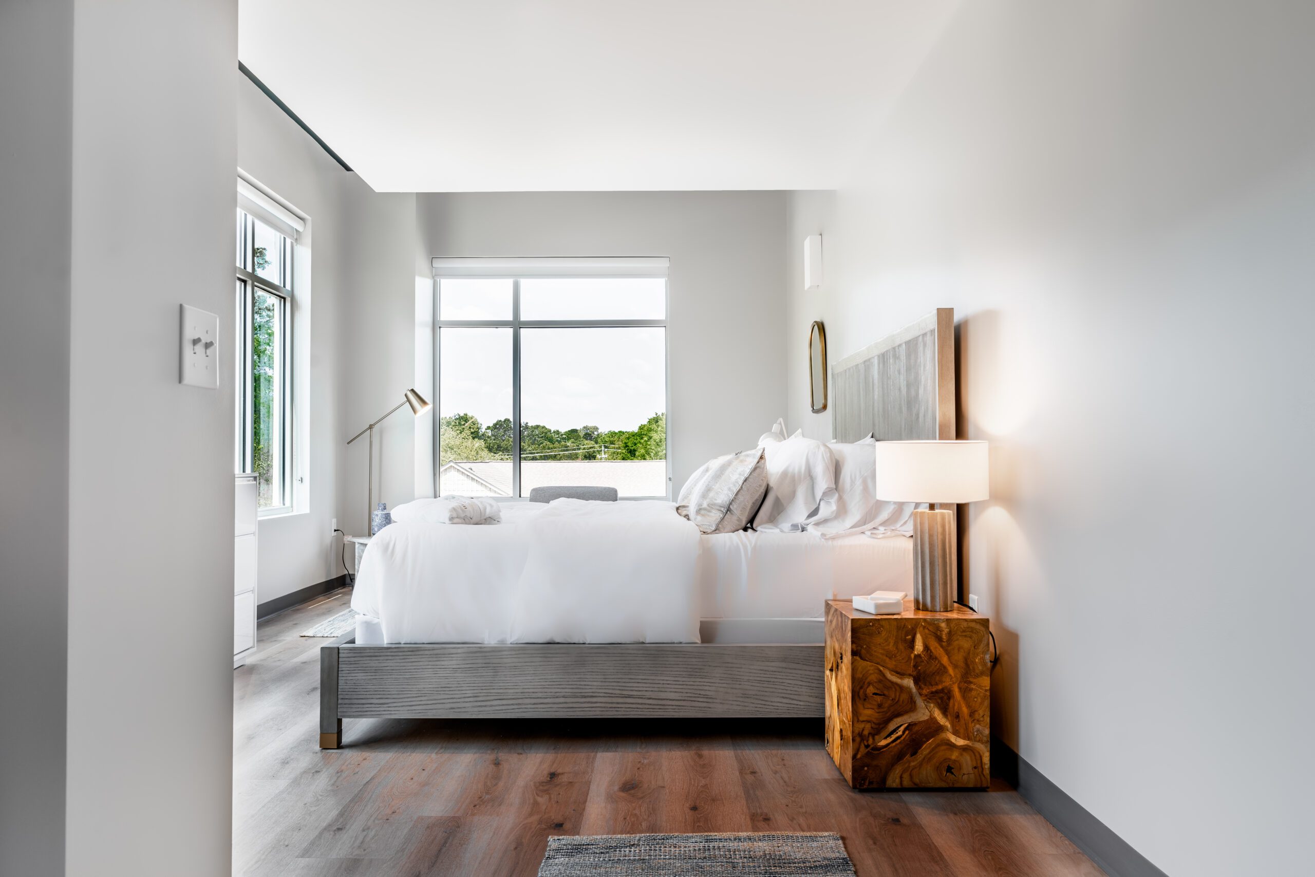 Bright private suite with modern furnishings and large window