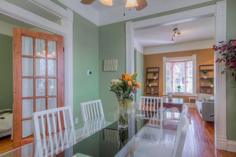 Bright dining area with glass table and seating