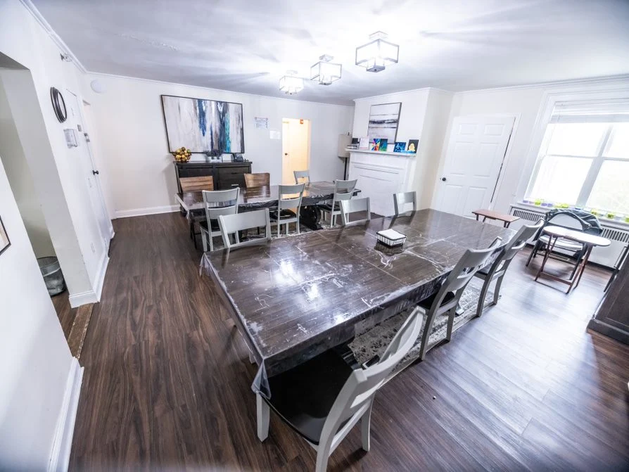 Group dining room with tables for meals and activities