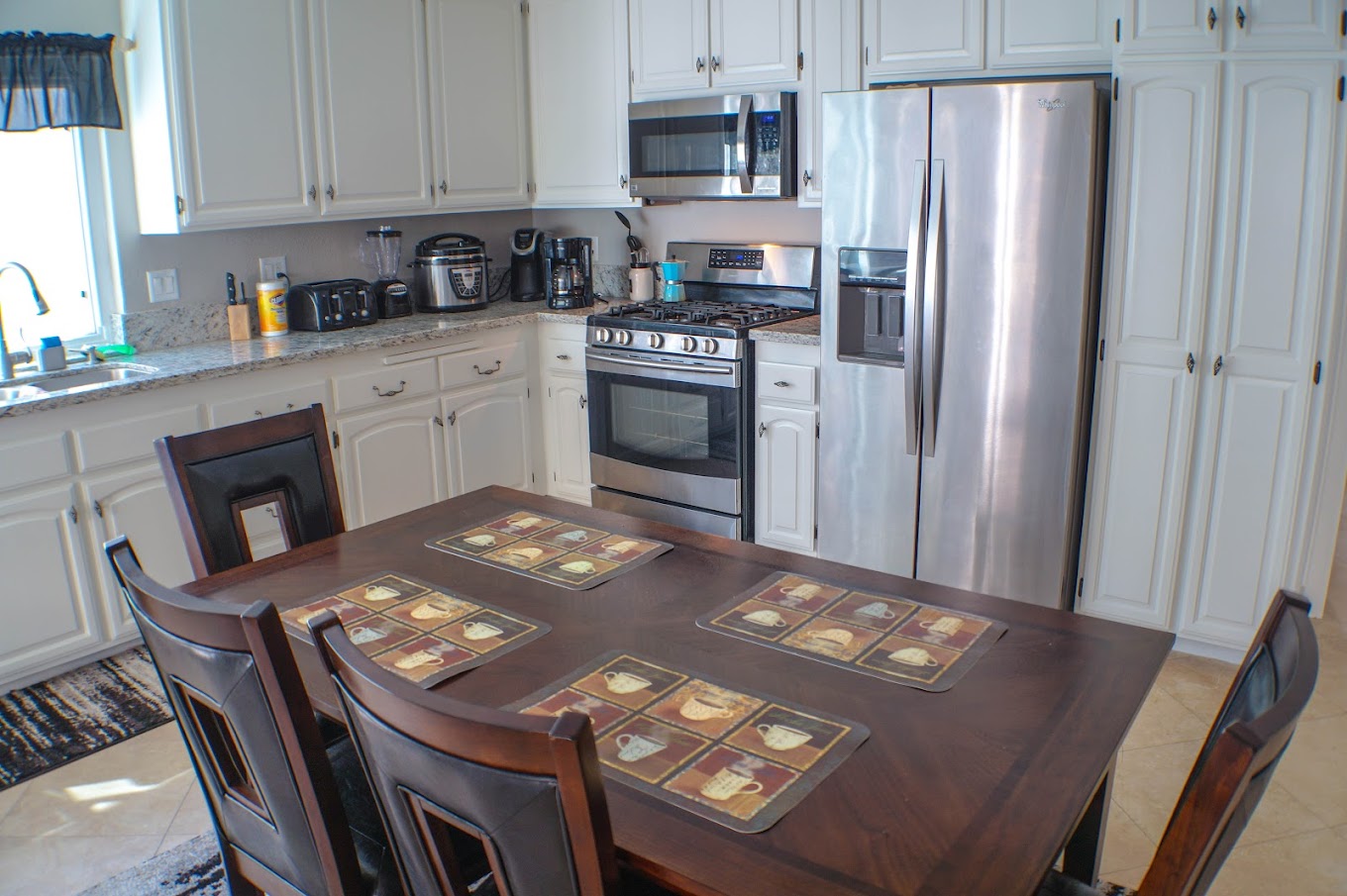 Kitchen with a dining area centered.