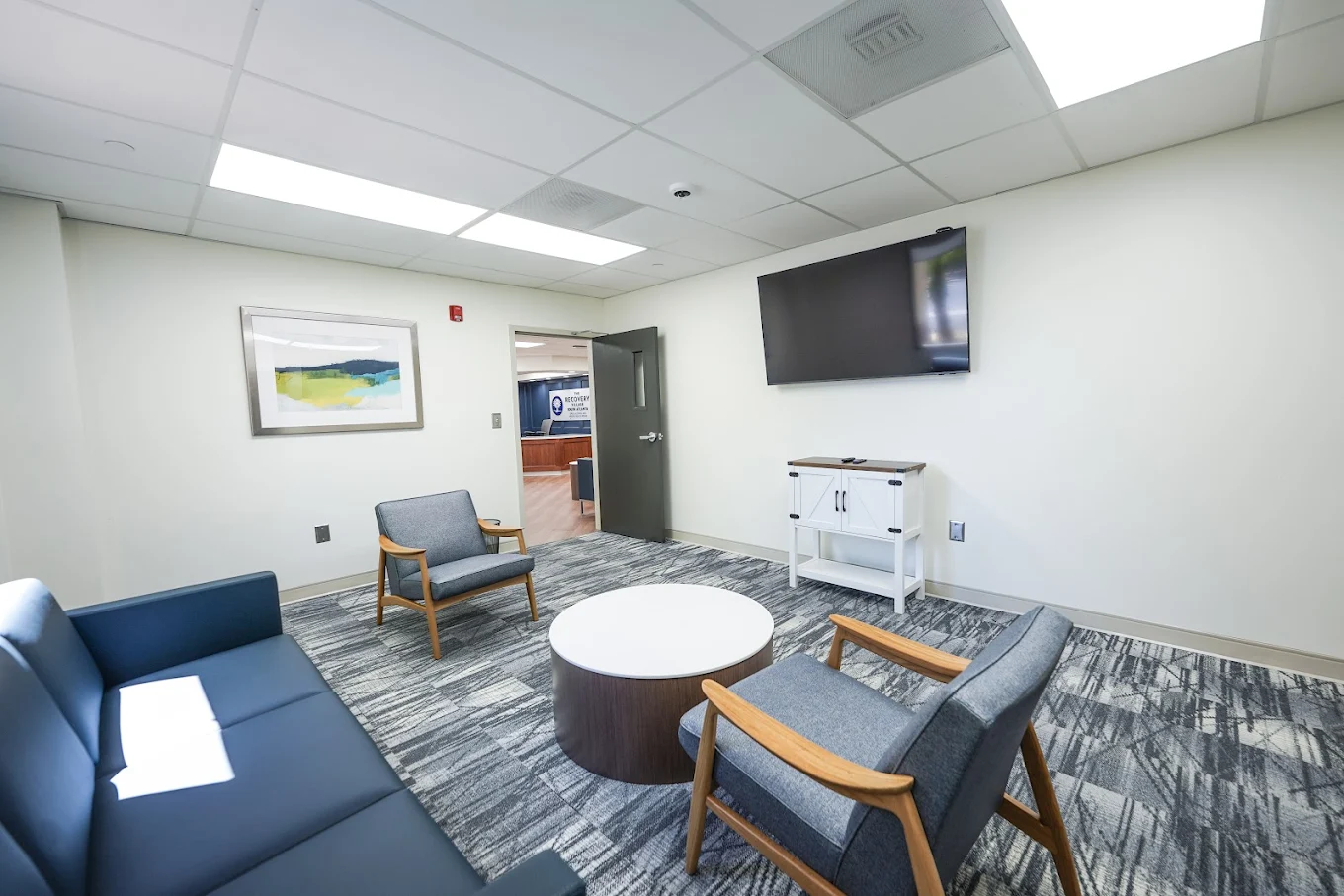 Comfortable lounge with seating and wall-mounted TV