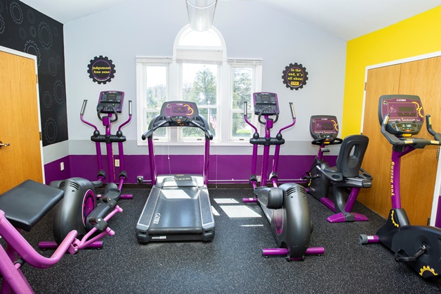 On-site fitness room with treadmills and exercise machines