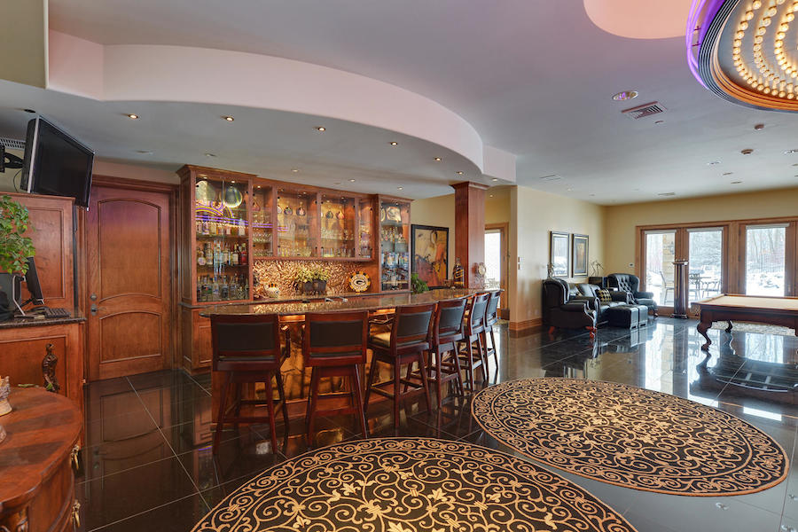 Elegant bar and lounge with pool table and seating