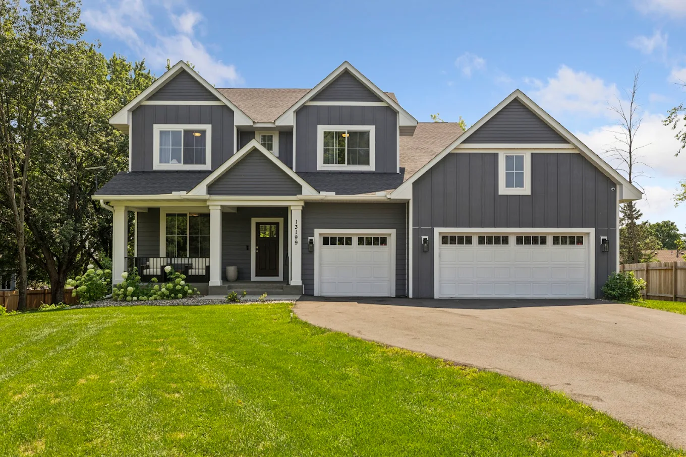 Large gray home with attached three-car garage