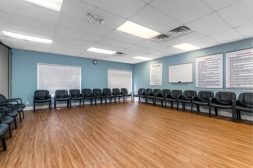 Group therapy room with chairs in a circle.