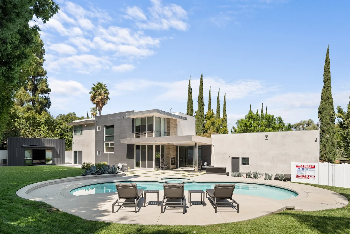 Modern rehab center with pool and patio seating