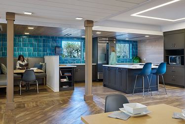 Kitchen with island seating and blue tile backsplash