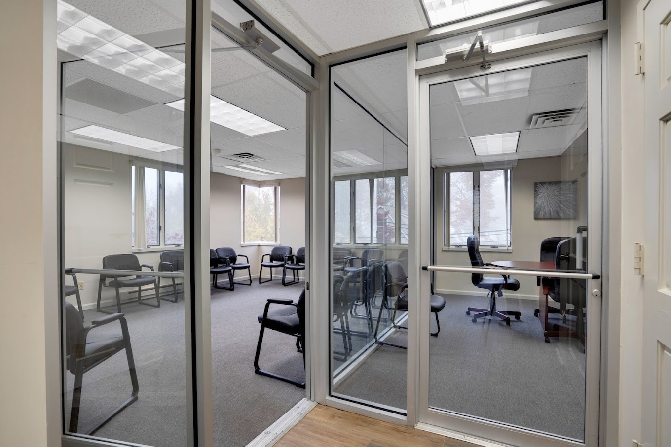 Group therapy room with chairs along the wall.