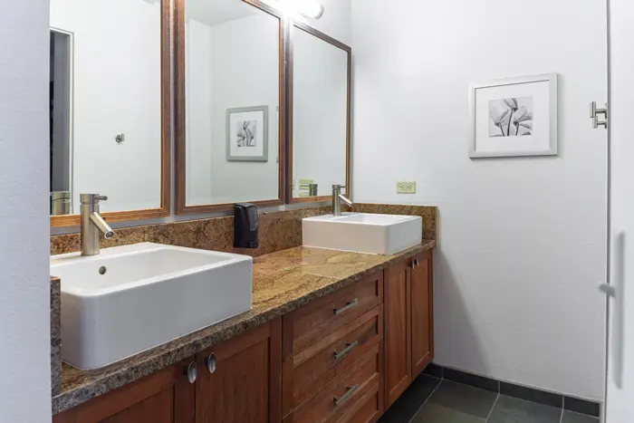 Double vanity with vessel sinks and wood cabinetry