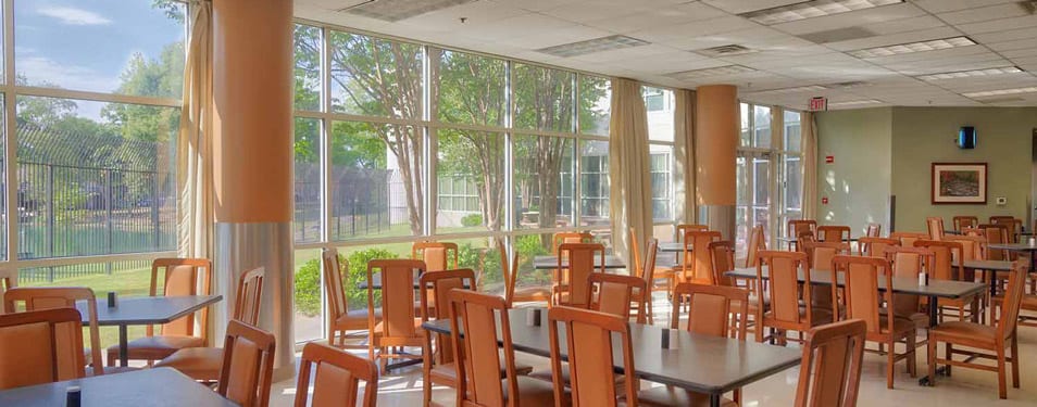 Bright dining room with tables and large windows