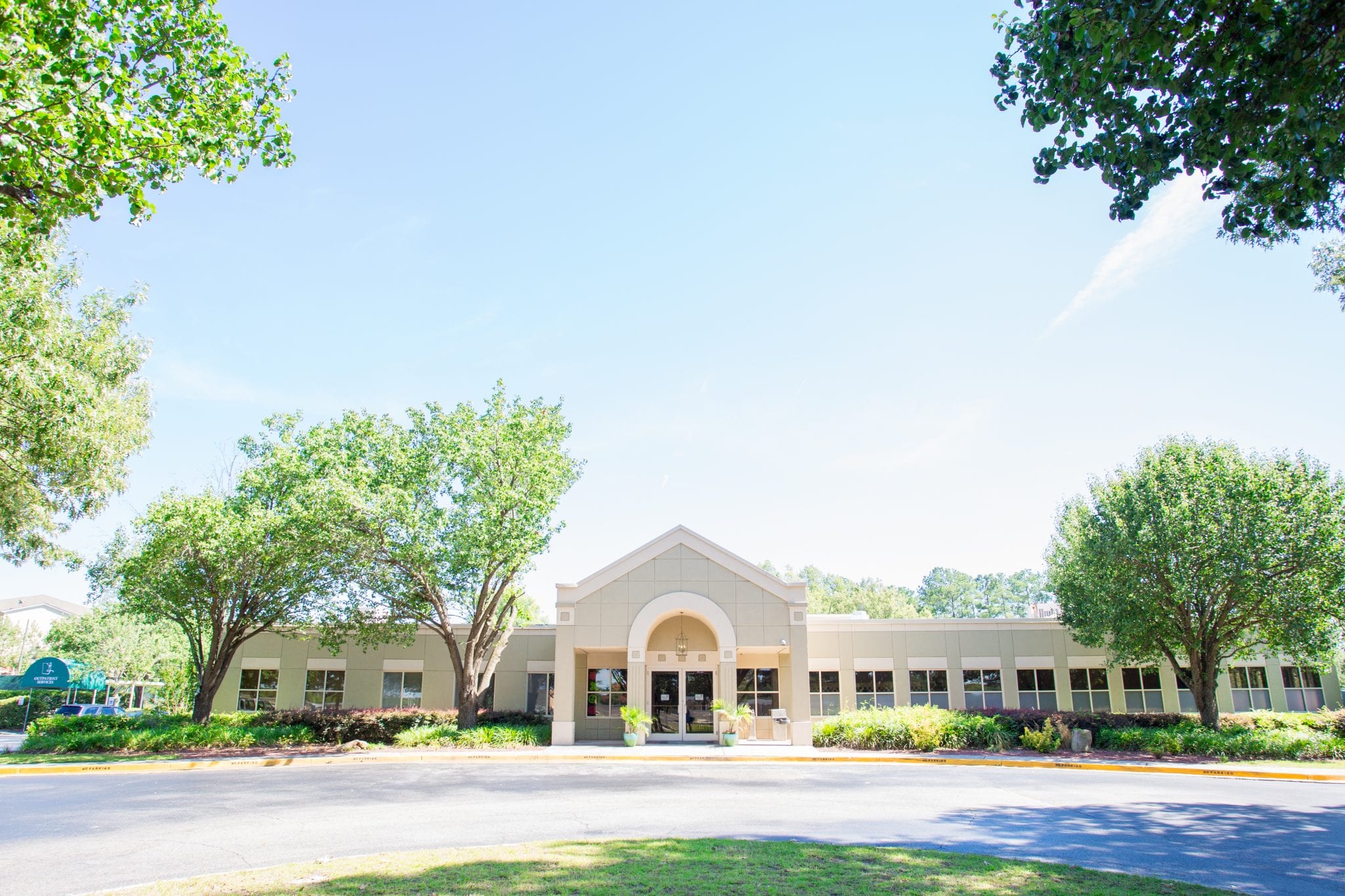 Front entrance of Lighthouse Care Center with landscaping