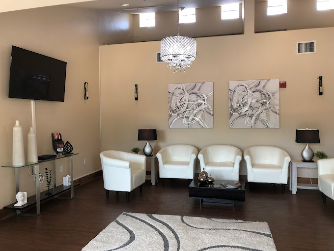 Lounge area with sofas,a TV and a coffee table.