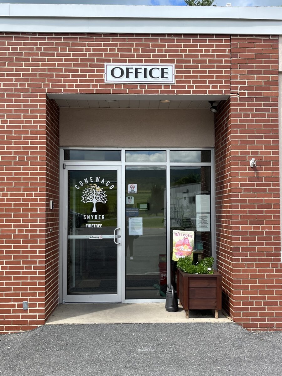 Rehab center brick office entrance with welcome signs