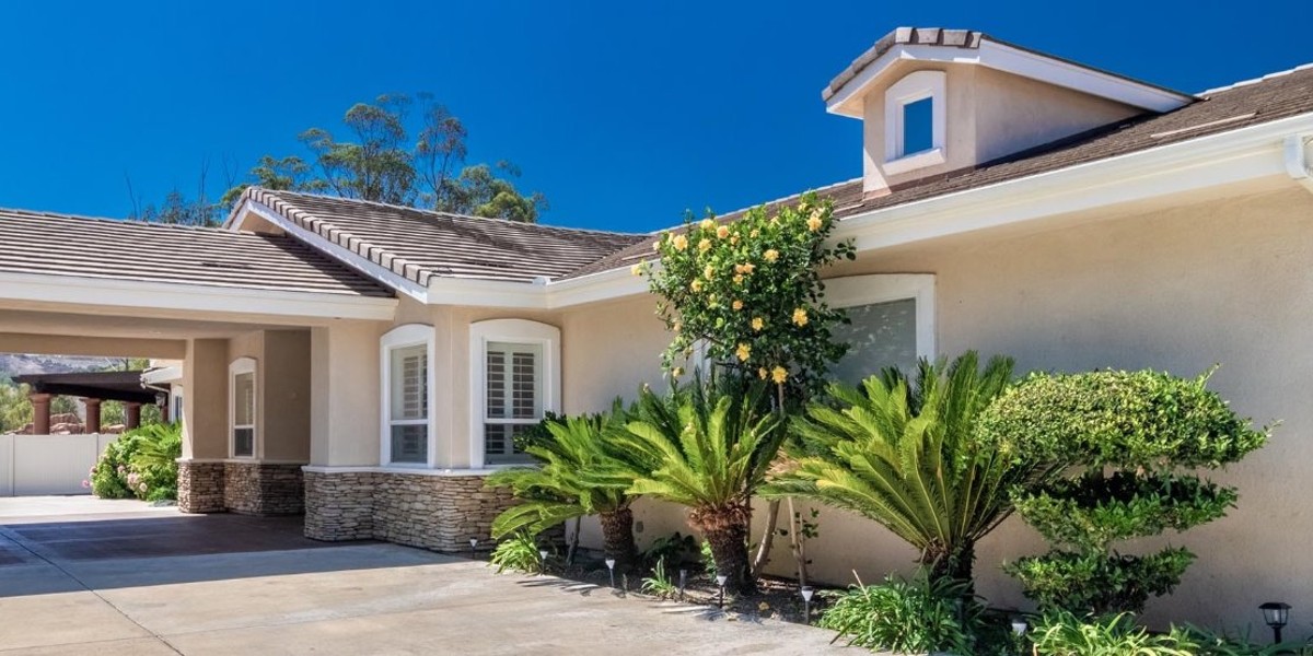 Modern beige residential-style treatment facility with landscaped greenery