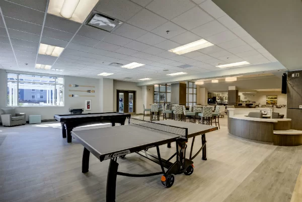 Activity space with ping pong, pool table, and café area