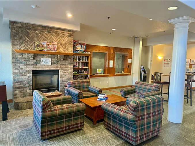 Lounge seating around brick fireplace and coffee table