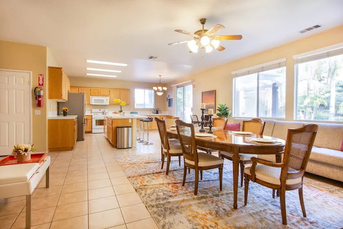 Dining and kitchen area with bright lighting and open plan