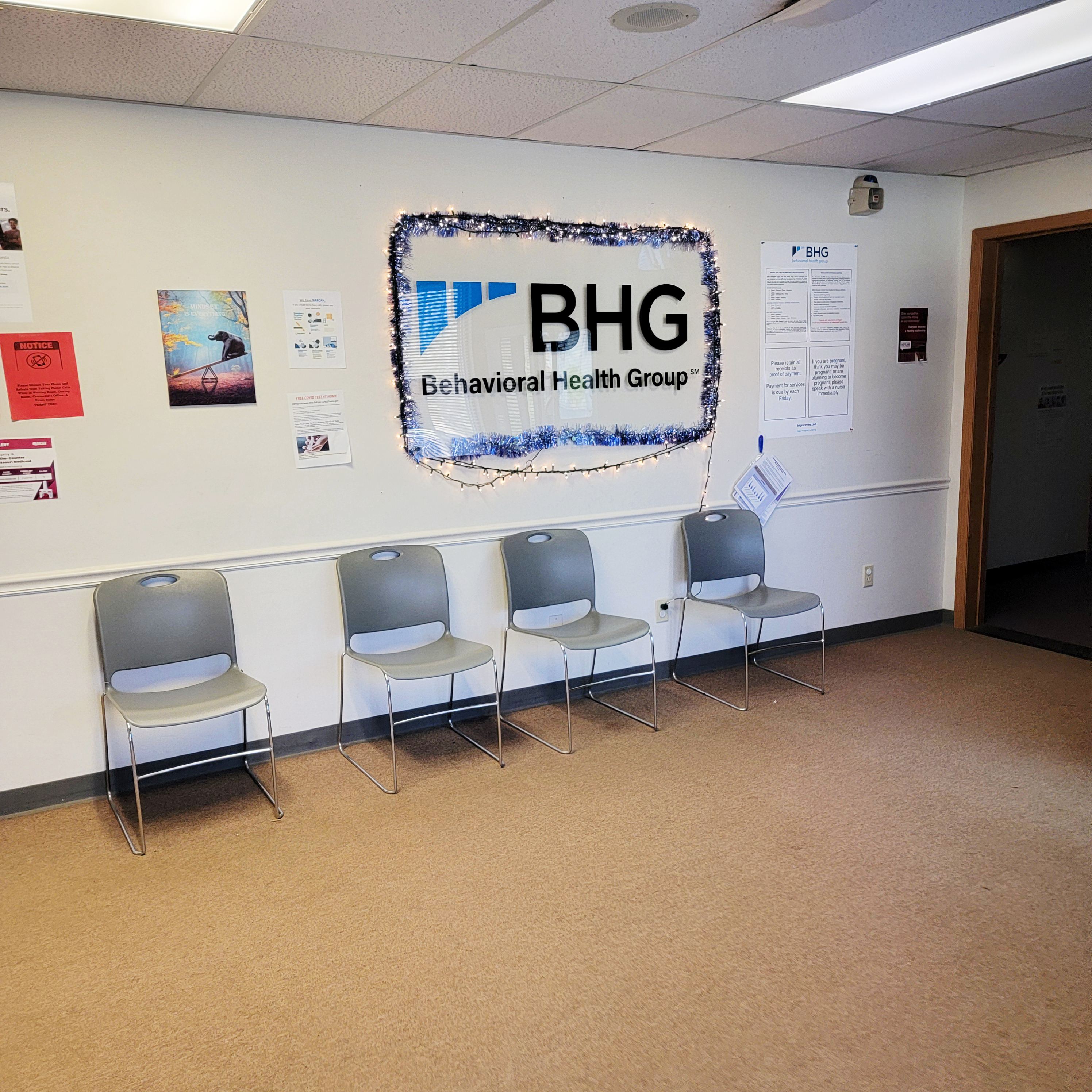 Waiting area with chairs and BHG wall sign