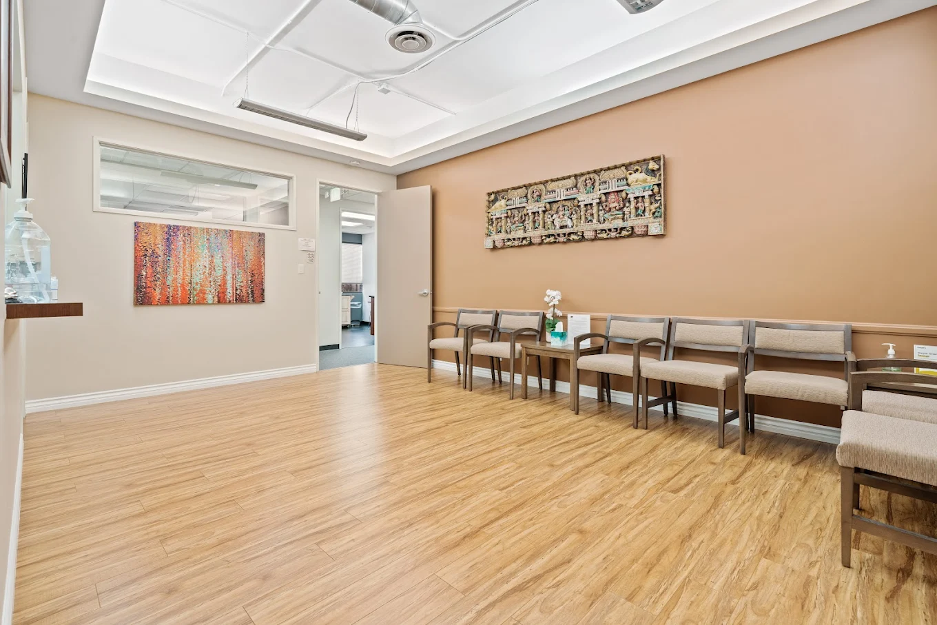 Spacious waiting room with chairs and artwork