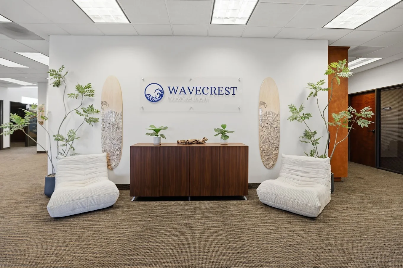 Wavecrest logo displayed in a welcoming seating area