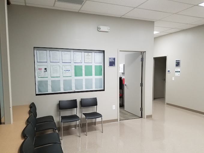 Exterior of a treatment center with large windows and handicap parking.