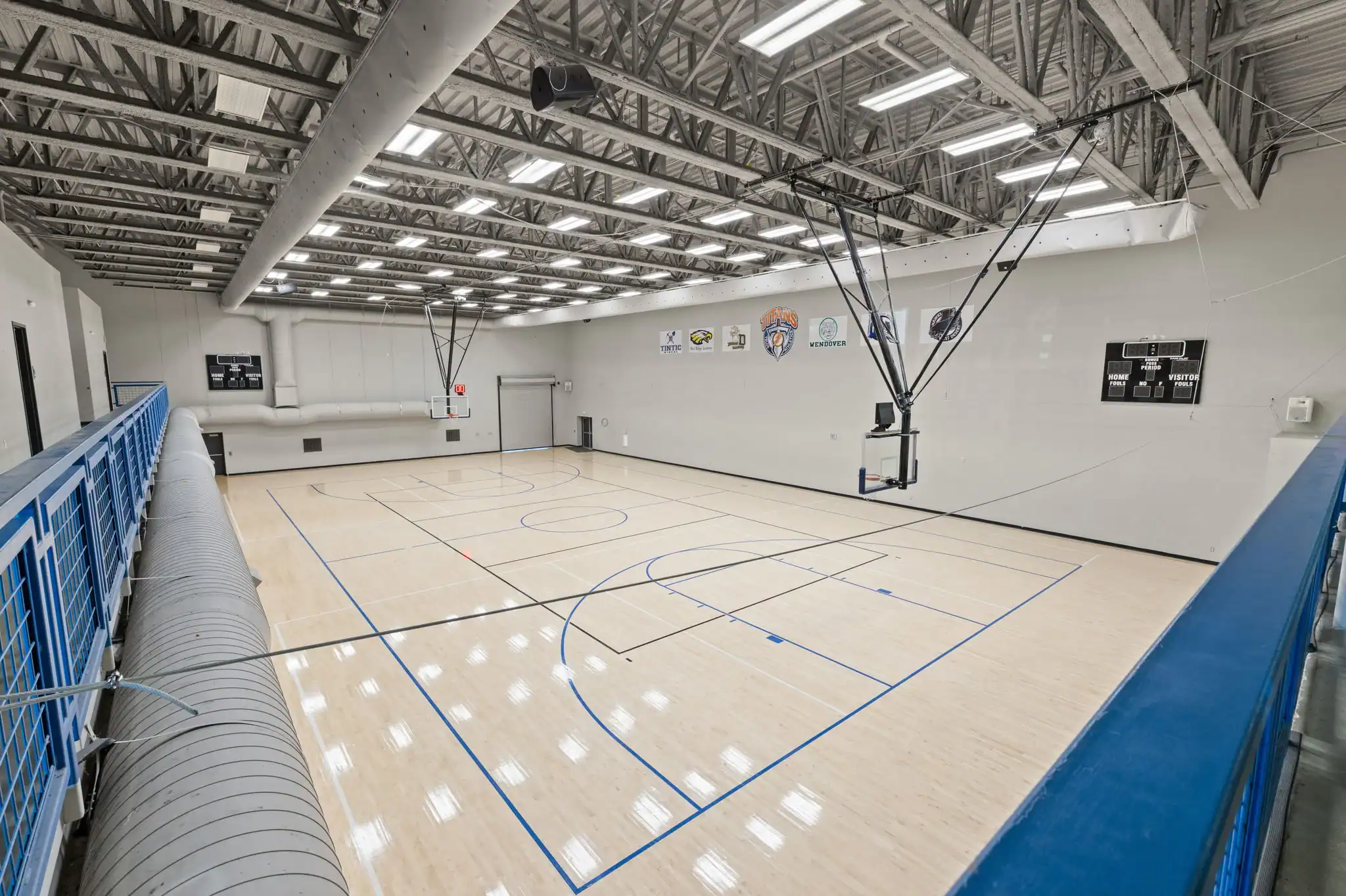 Full-size indoor gymnasium with basketball court