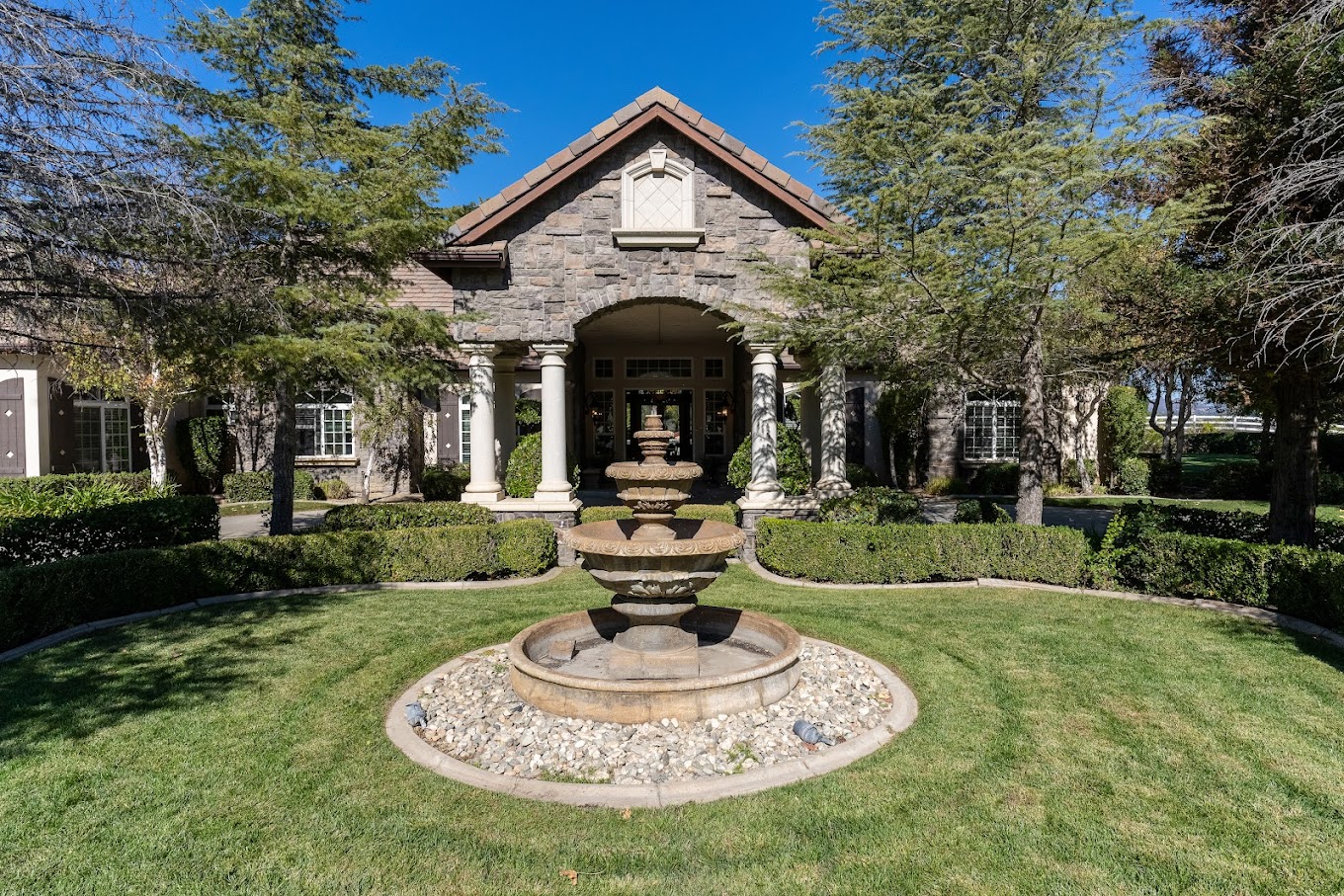 Front entrance with landscaped fountain area