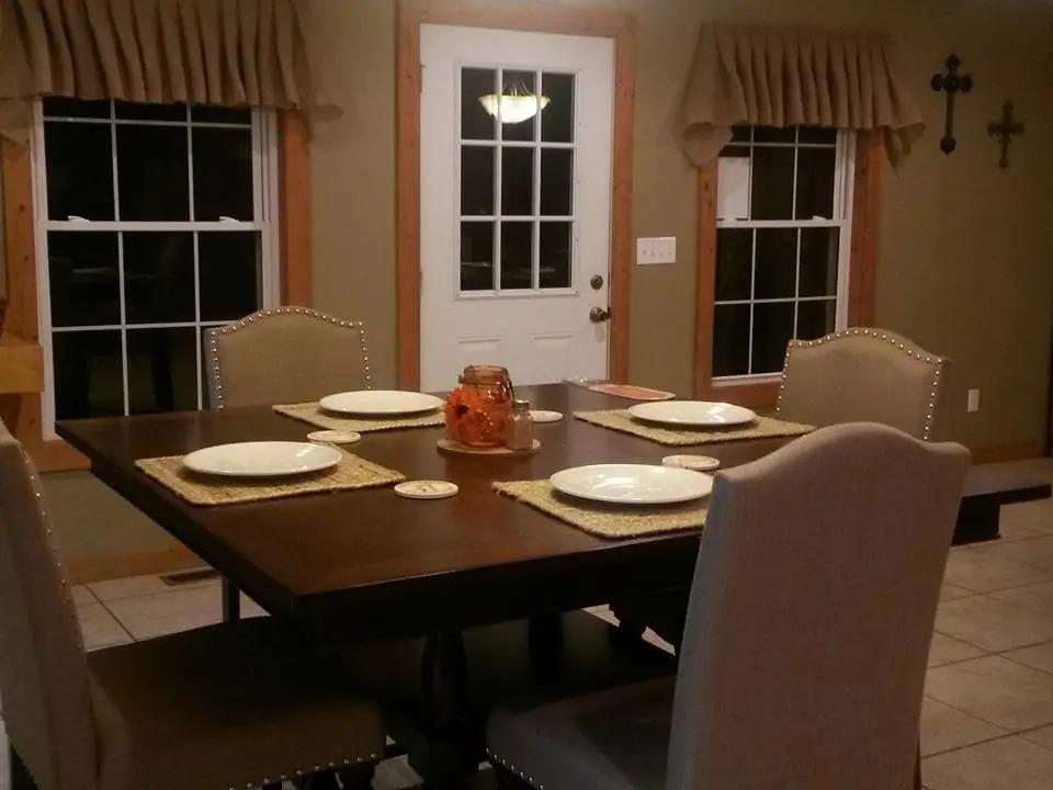 Warm and welcoming dining room at Kisa Life Recovery Sedan, featuring a beautifully set table and comfortable seating.