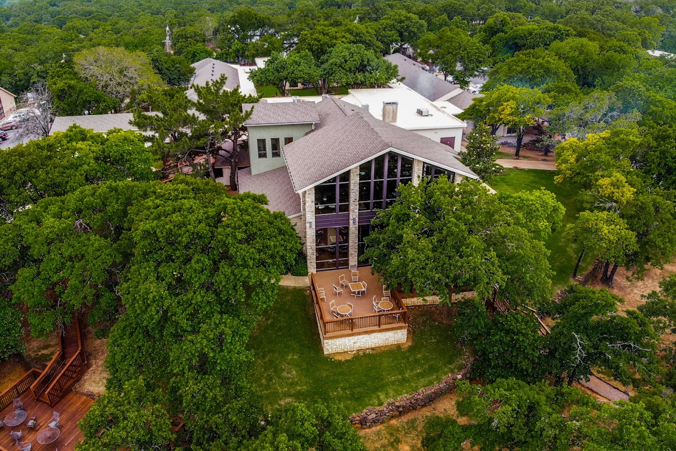 Aerial view of a rehab center among lush green trees