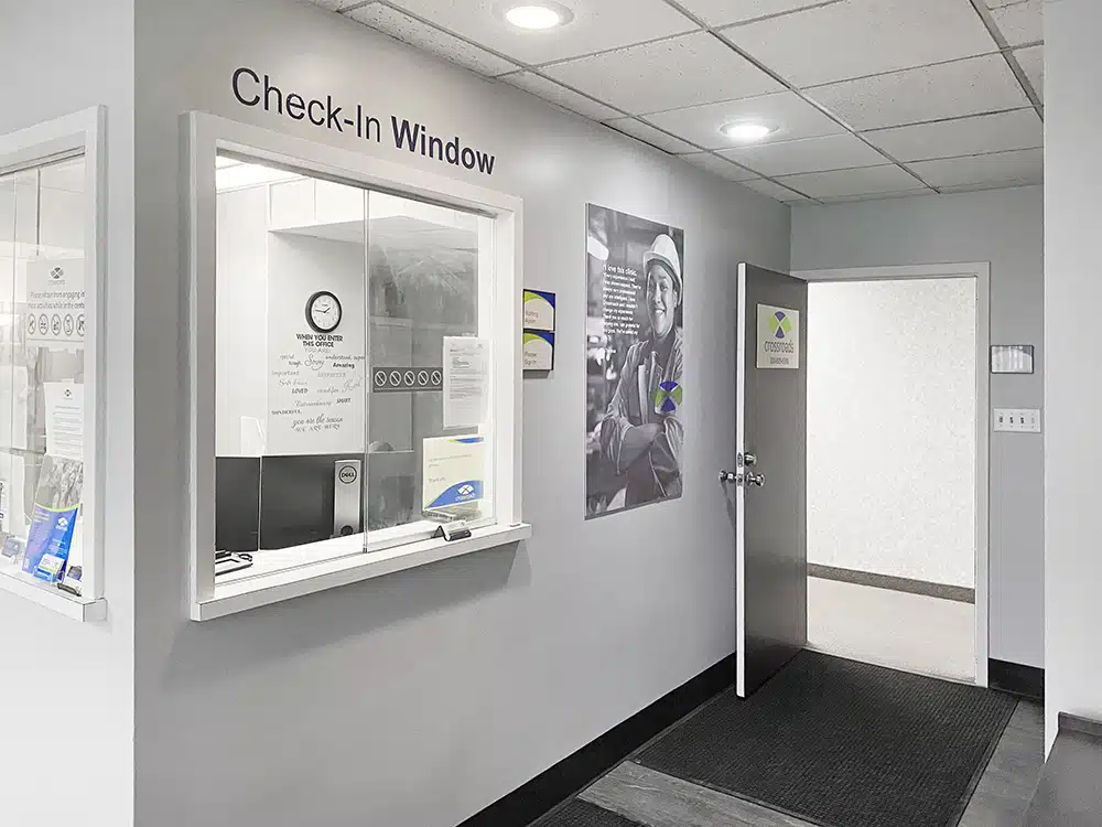 Check-in window and open doorway in clinic interior