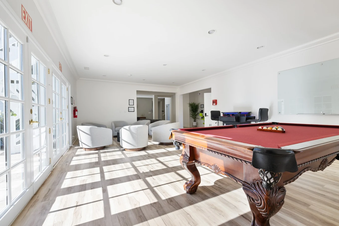 Game lounge with pool table and casual seating