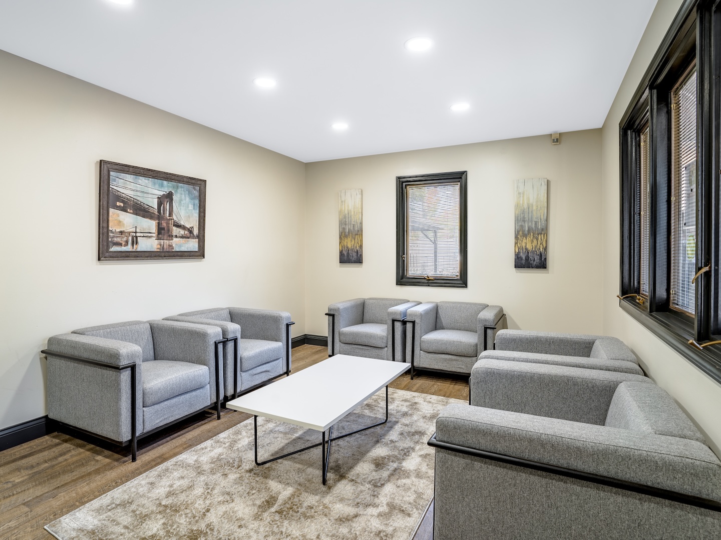 Room with gray chairs arranged for group meetings