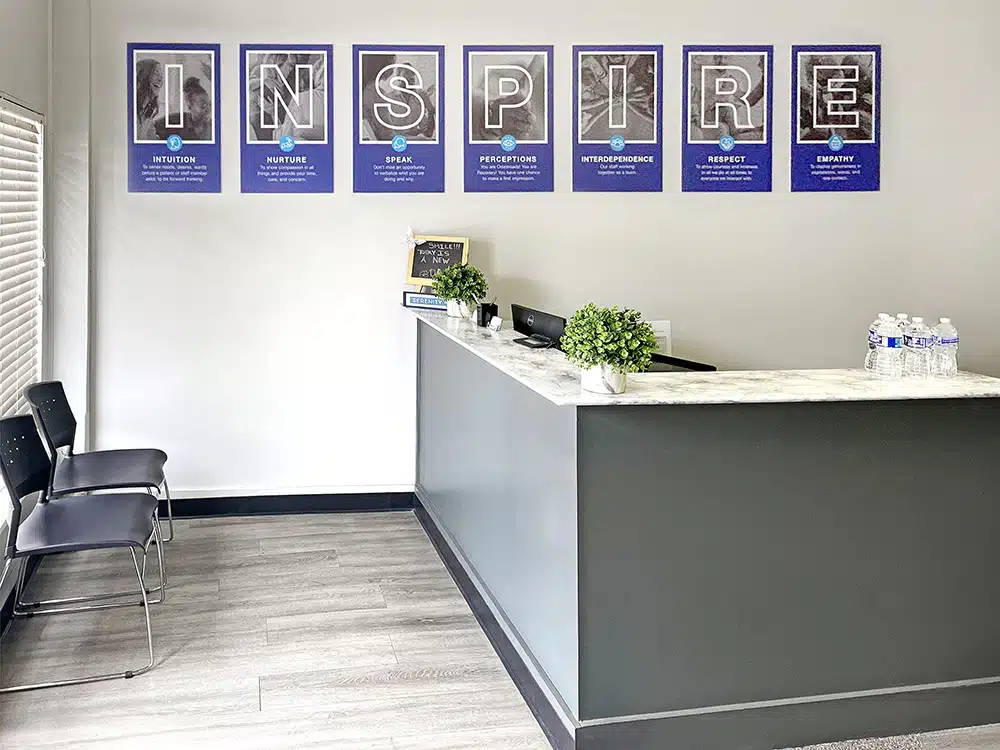 Reception desk with plants and Inspire values wall display