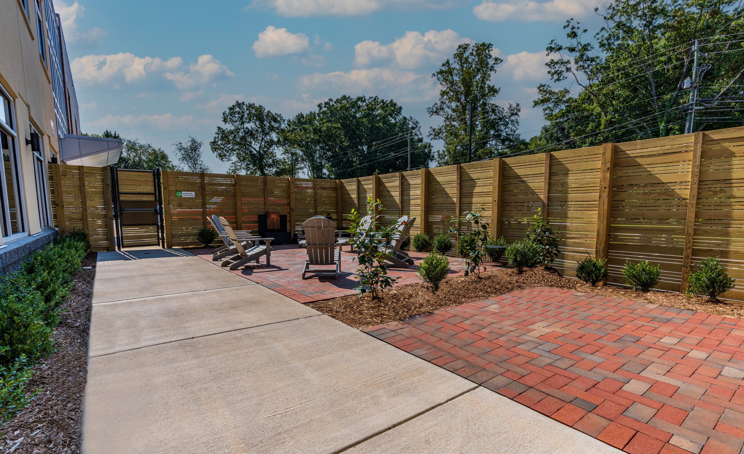 Private courtyard with seating and landscaped garden