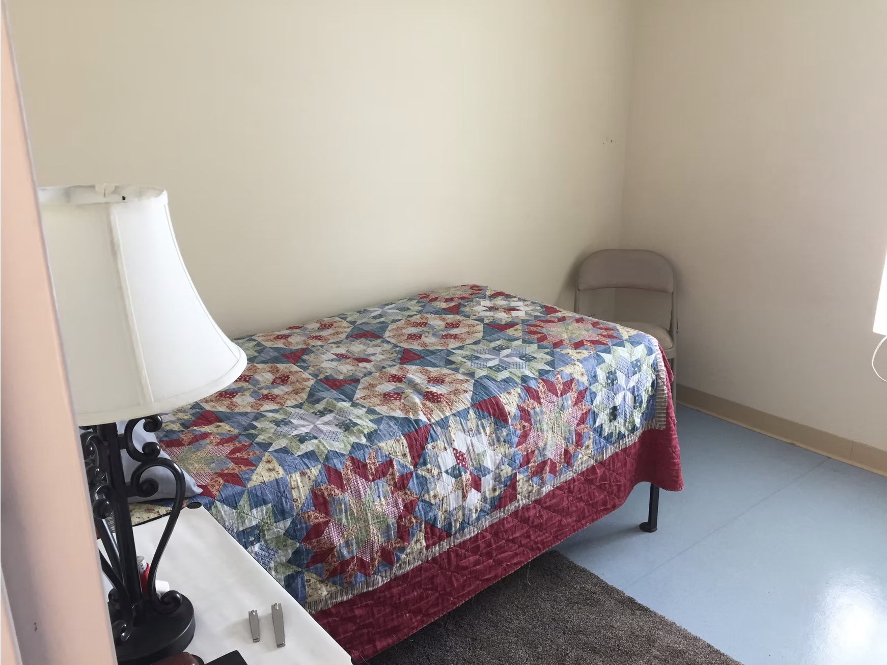 Shared patient bedroom with two beds and storage at Serenity Place in Dover